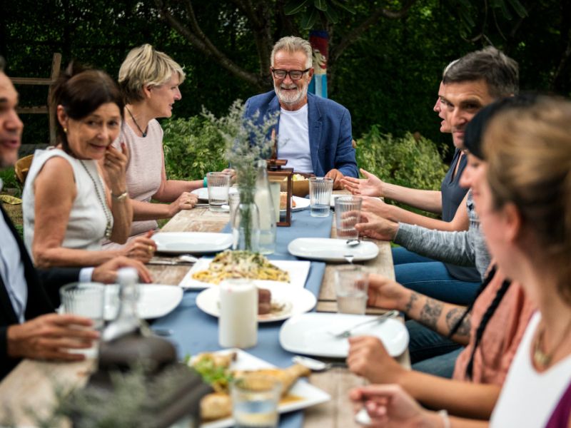group of friends eating at a garden party