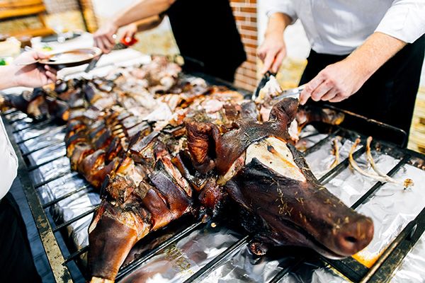 caterers serving a hog roast