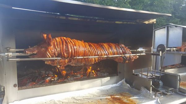 roasted pig on a wood fire