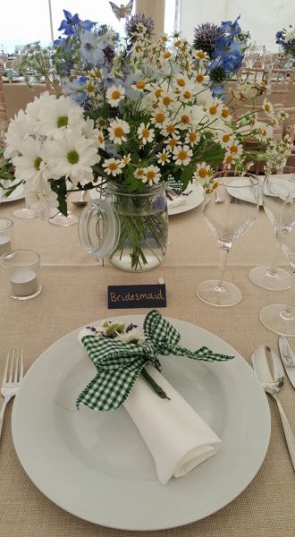 table with plate and flowers for a wedding