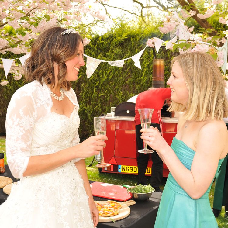two women chatting at wedding venue