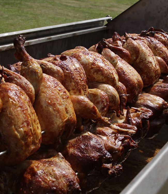 pork and turkey on a wood fire spit