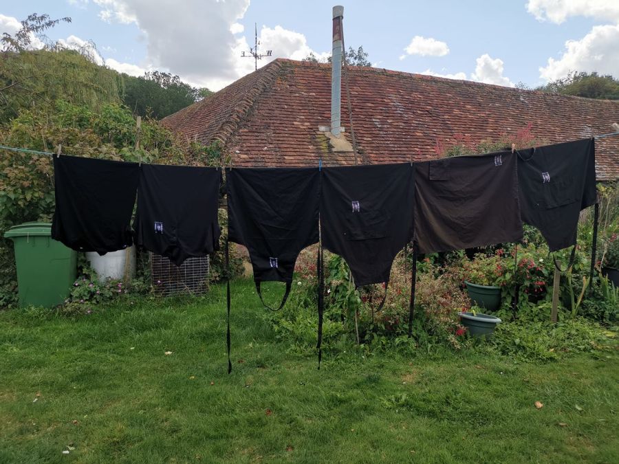 aprons hanging on a clothes line
