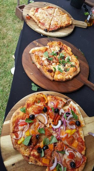 3 pizzas on wooden boards