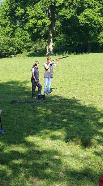 2 people clay pigeon shooting