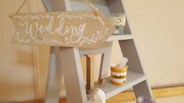 ladder with ice cream and sign